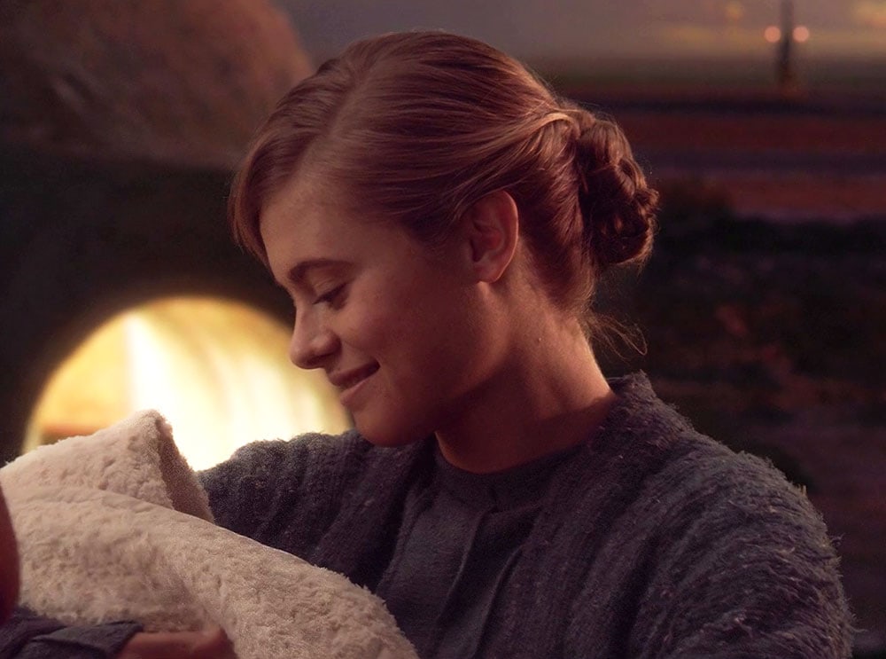Beru Lars (Bonnie Piesse) holding baby Luke Skywalker in Revenge of the Sith - Lucasfilm Ltd.