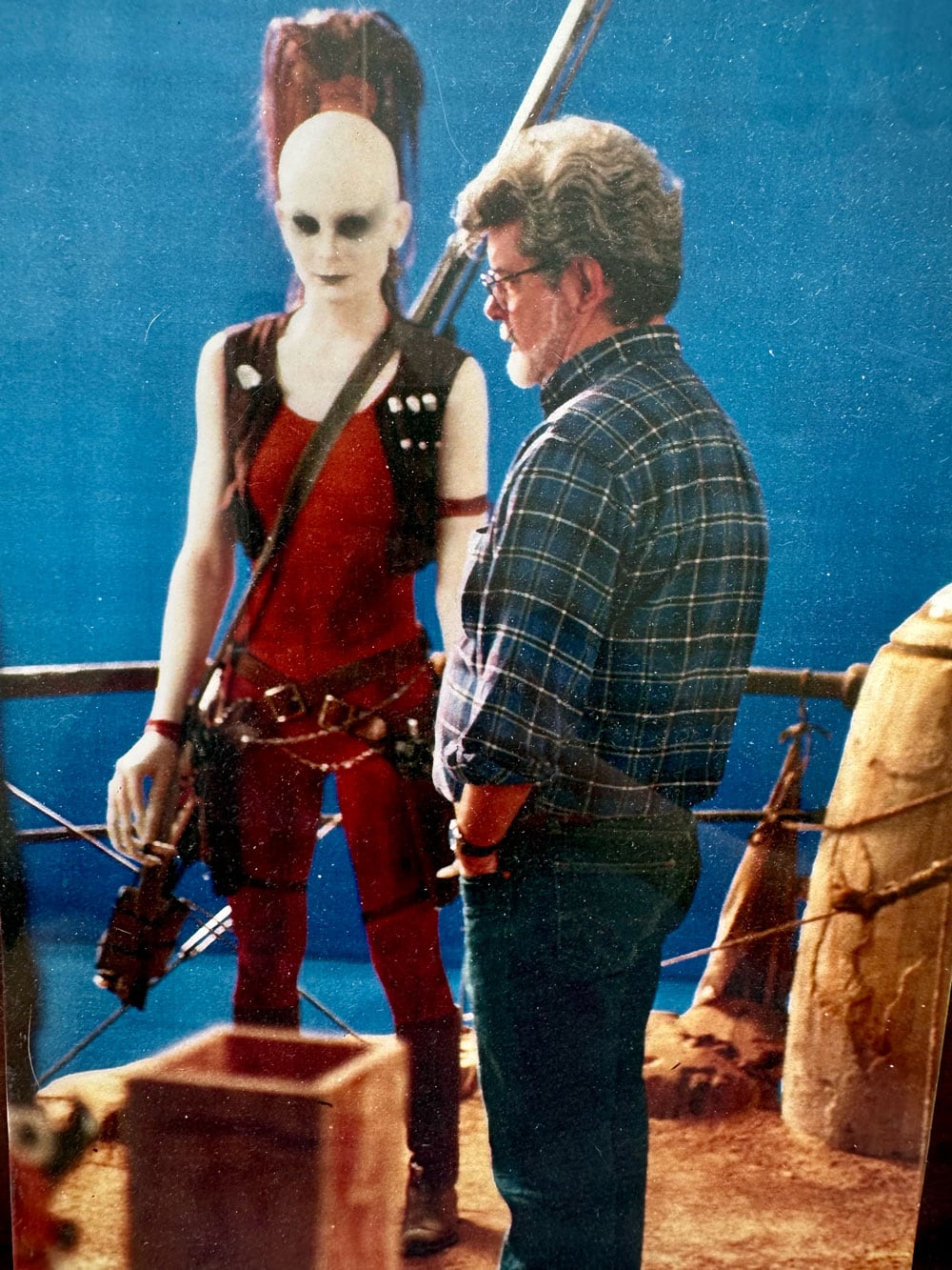 (L-R): Aurra Sing (Michonne Bourriague) and George Lucas at the ILM set of The Phantom Menace - Lucasfilm Ltd.