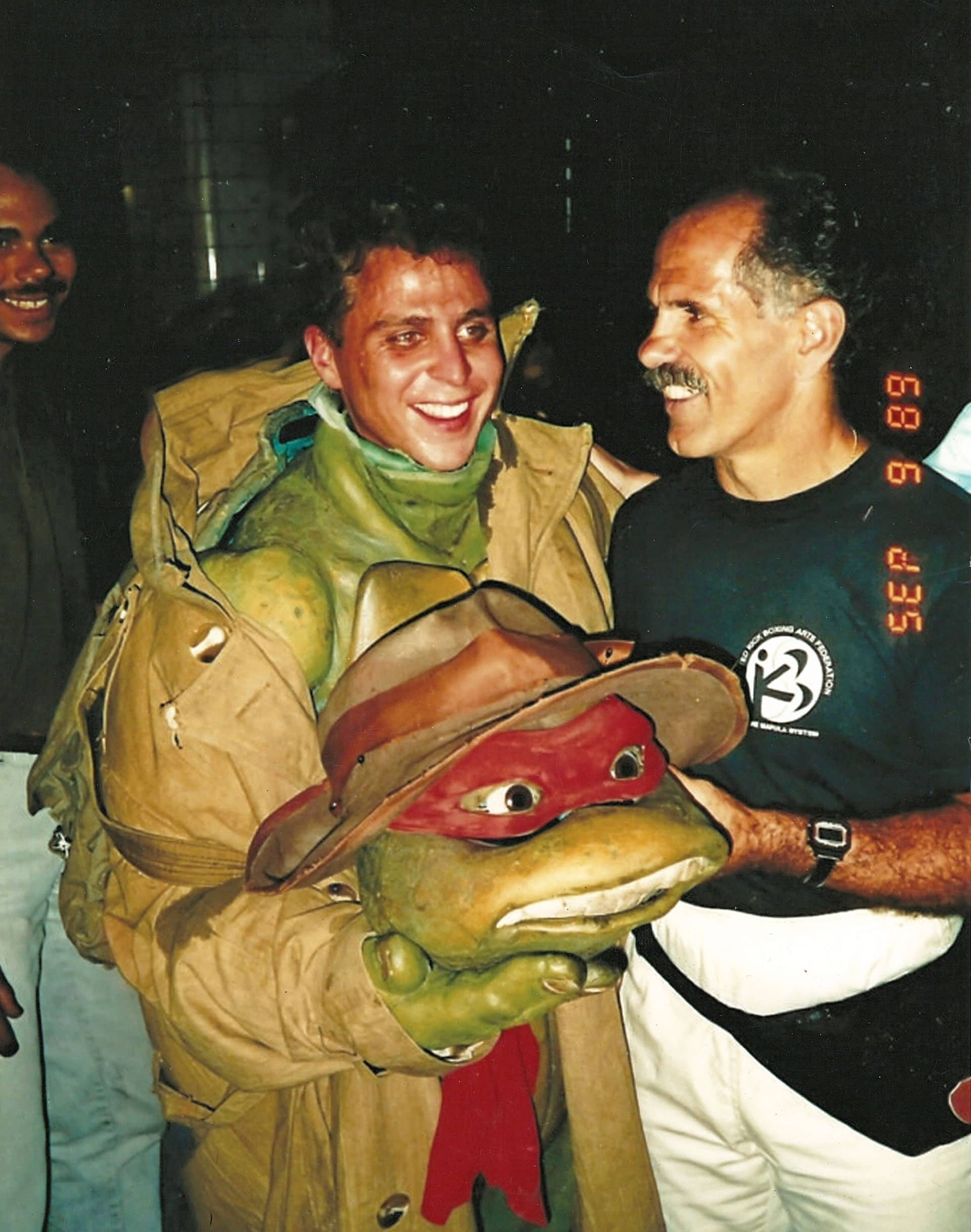 (L-R): Kenn Scott in the Raphael action turtle suit and fight choreographer Pat E. Johnson working on the car stunt in Teenage Mutant Ninja Turtles - © 888 Productions / Entertainment Pictures